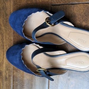 Chloe Lauren scalloped mules.